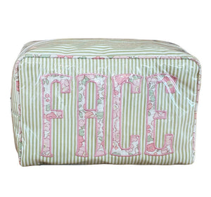 The Walker Valentine Large Milan Cosmetic Case, "FACE," is a rectangular striped travel makeup bag with a floral pattern and bold pink lettering—ideal as a beauty organizer for your essentials.