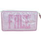 The Small Helen Cosmetic Case "FACE" by Walker Valentine features pink and white stripes, a zippered closure, and "FACE" embroidered in bold pink letters—your perfect travel makeup bag.