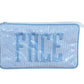 The Walker Valentine Small Helen Cosmetic Case, "FACE," is a blue and white striped zippered makeup bag with bold embroidered letters under a clear cover—perfect for organizing your essentials.