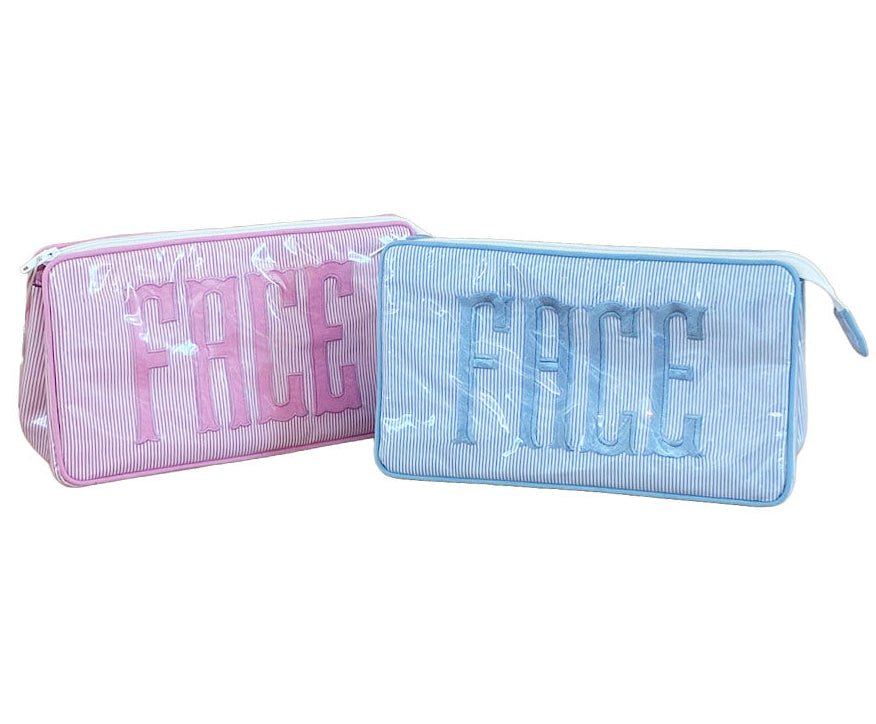 The Walker Valentine Small Helen Cosmetic Case, "FACE"—two rectangular zippered pouches in pink and blue—are perfect for organizing makeup essentials on the go.