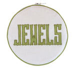 The Walker Valentine Jewelry Roll, "JEWELS," features bold green embroidery on white fabric—a stylish and practical accent for organizing or traveling with your jewelry.