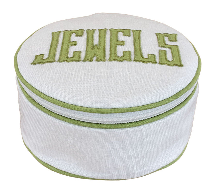 The Walker Valentine Jewelry Roll, "JEWELS," is a round white pouch with green trim and "JEWELS" embroidered on the lid—perfect as a compact travel jewelry organizer for stylish storage on the go.