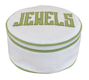 The Walker Valentine Jewelry Roll, "JEWELS," is a round white pouch with green trim and "JEWELS" embroidered on the lid—perfect as a compact travel jewelry organizer for stylish storage on the go.