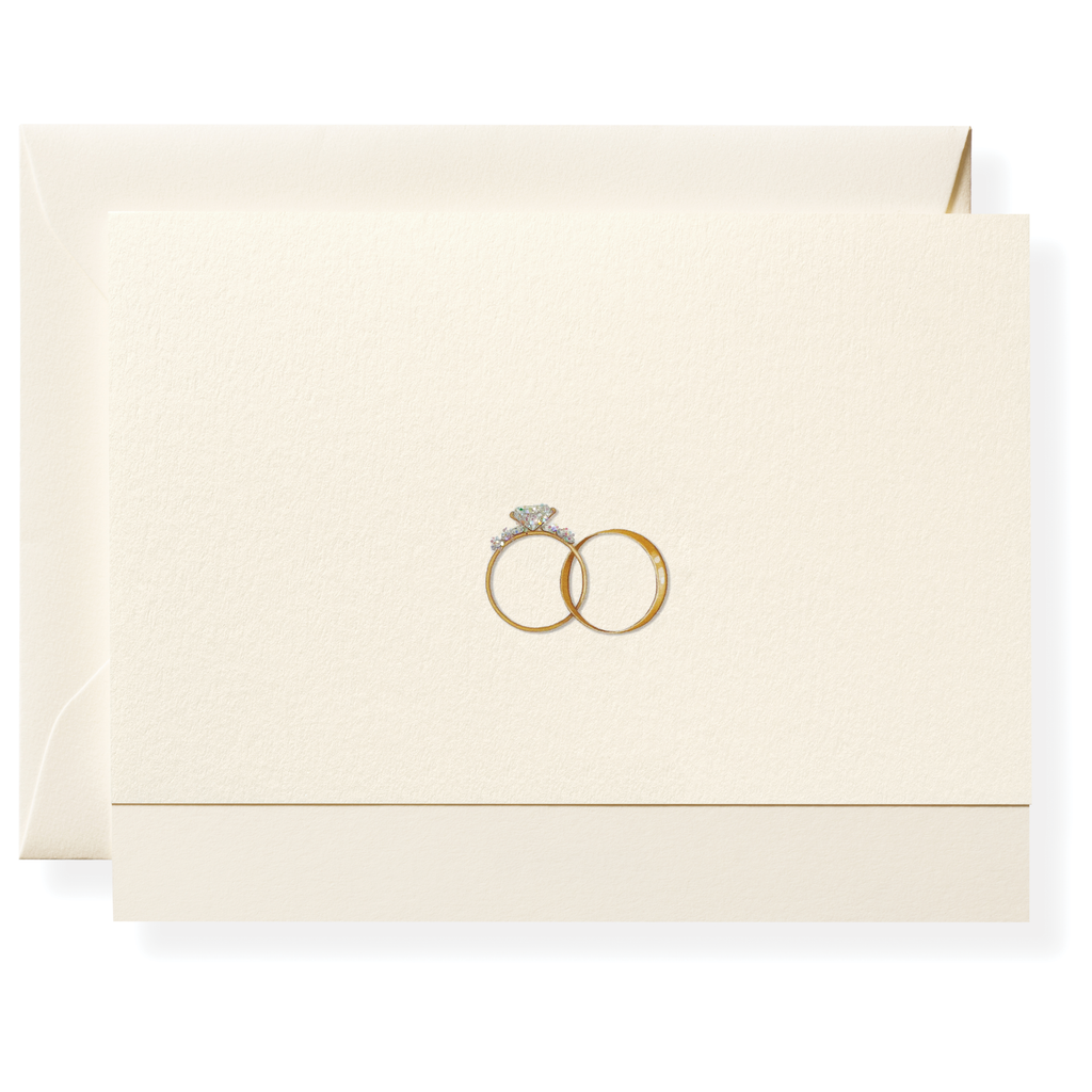 The Just Married Card Set by Karen Adams features a cream hand-embellished card and envelope with two intertwined gold rings, one with a diamond—ideal for weddings or as a thoughtful hostess gift.