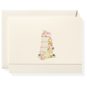The Just Married Card Set by Karen Adams features an ivory, hand-embellished card and envelope with a white tiered cake adorned with pink flowers and green leaves—an ideal hostess gift.