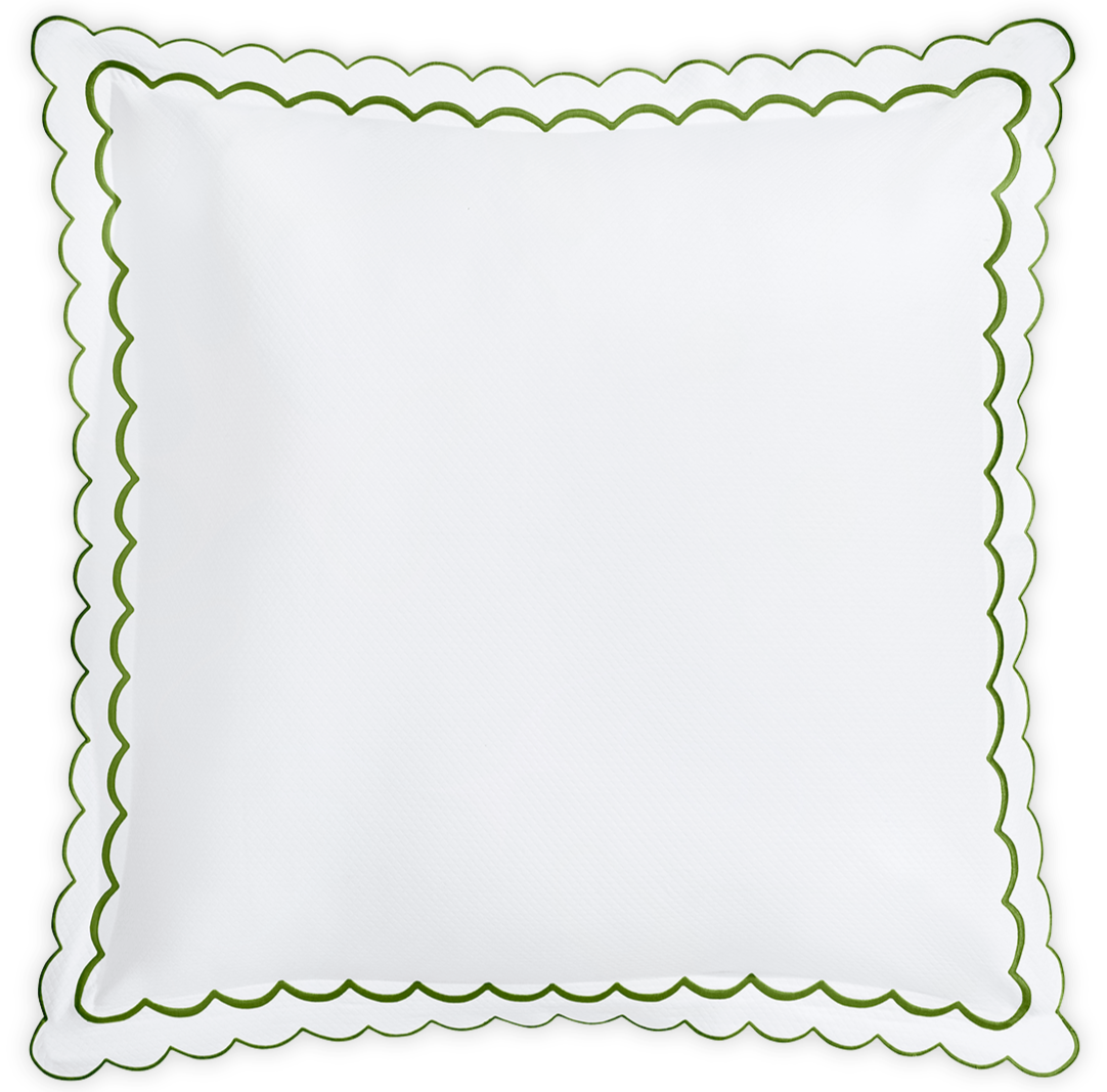 The Matouk India Pique Bedding Collection, Grass, features a square white pillow with a green scalloped edge, crafted from a soft cotton blend. The design is plain and elegant, with no extra patterns or decorations.