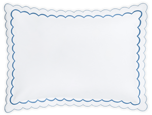 The India Pique Bedding Collection, Azure by Matouk features a white rectangular pillow with diamond pique texture and scalloped edges outlined in azure, inspired by double-scallop embroidery for an elegant look.