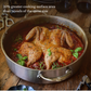 A roasted spatchcock chicken in tomato sauce sits in the Hestan Thomas Keller Commercial Clad Stainless Steel Rondeau, 6qt, garnished with fresh basil. The wide, shallow design offers increased cooking surface area and showcases premium craftsmanship.