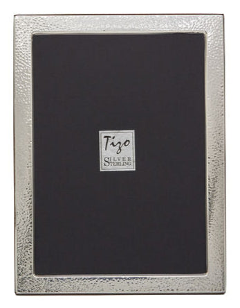 The Italian Sterling Silver New Hammered Frame Collection by Tizo Design features a rectangular frame with a textured, tarnish-resistant 925 silver border and a black placeholder displaying "Tizo Silver Sterling" in the center.
