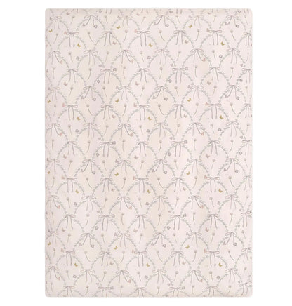 The Gooselings Bows & Butterfly Kisses Toddler Duvet features a pale pink background with grey bows and yellow dots, making it perfect for a cozy nursery.