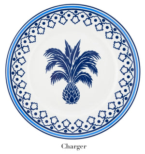 The Jaipur Blue Dinnerware Collection by Aquazzura Casa features a white porcelain charger plate with a handcrafted blue border, central pineapple motif, and "Charger" label beneath the plate.
