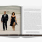 Two individuals dressed in James Bond Style, a timeless fashion by Assouline, stroll across a sandy landscape depicted on the pages of an open book, with text gracing the left-hand page.