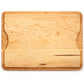 The J.K. Adams Maple BBQ Cutting Board features a groove along one edge, a lighter wood strip near the bottom, and natural wood grain patterns—perfect for all your barbecue carving needs.