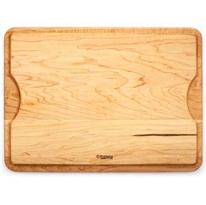 The J.K. Adams Maple BBQ Cutting Board features a groove along one edge, a lighter wood strip near the bottom, and natural wood grain patterns—perfect for all your barbecue carving needs.
