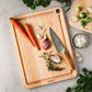 The J.K. Adams Maple Prep Cutting Board is perfect for meal prep, featuring a juice groove to catch drips and ample space for chopping carrots, shallots, garlic, thyme, Brussels sprouts, and parsley with your favorite knife.