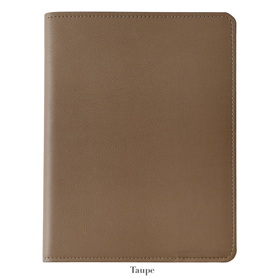 The Graphic Image 7" Leather Notebook, featuring closed taupe leather with visible edge stitching, is displayed against a white background—an ideal companion for capturing your ideas.