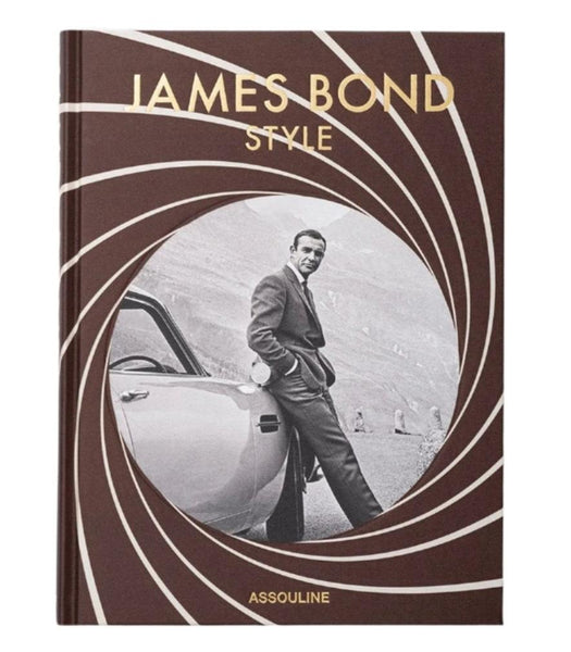 The cover of Assouline's book "James Bond Style" showcases a man in a suit leaning against a car with a spiral design overlay, capturing the essence of timeless fashion and iconic looks.