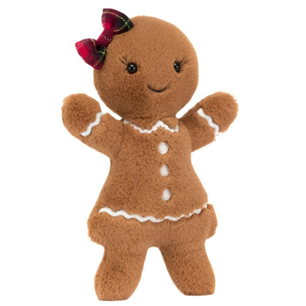 Introducing the Jellycat Jolly Gingerbread Ruby, a delightful plush doll perfect for Christmas. Created by the renowned brand Jellycat, she is adorned with an enchanting red bow and a cute icing dress featuring white icing details. With her arms raised in festive cheer, she's ready to spread holiday joy to everyone she meets.