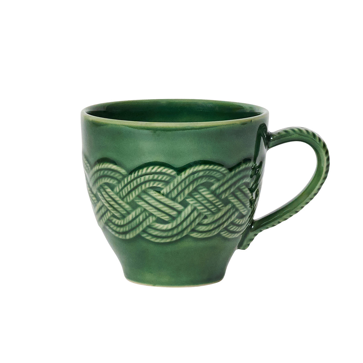A green ceramic mug by Juliska, featuring a braided rope pattern and textured handle, inspired by the Le Panier Mystic Knot Basil Dinnerware and Serveware Collection, set against a white background.