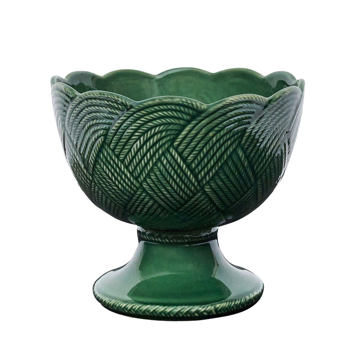 This green ceramic pedestal bowl by Juliska features a scalloped rim and basket-weave texture, perfect for serving or accenting your table. Part of the Le Panier Mystic Knot Basil Dinnerware and Serveware Collection.