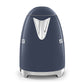 A navy blue Smeg Electric Kettle Collection appliance with a retro design, silver handle, and stainless steel body is shown from the back, with partial "S" and "G" lettering visible on its sides.