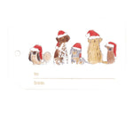The Crane Santa Dogs Gift Tag Set features five dogs in red Santa hats with "to:" and "from:" fields below—ideal for holiday gift giving.