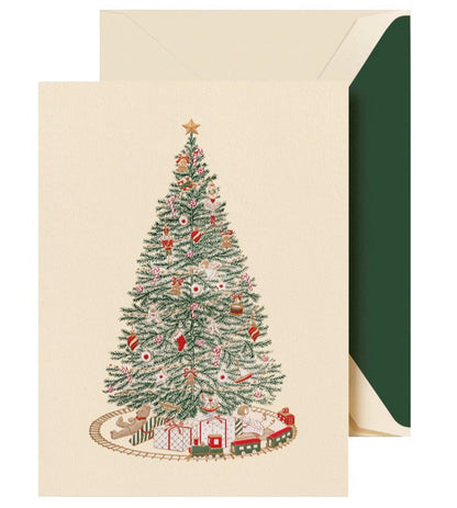 The Crane Christmas Morning Tree Card Set features a decorated tree with ornaments, gifts underneath, a toy train set, and comes with green-lined envelopes.