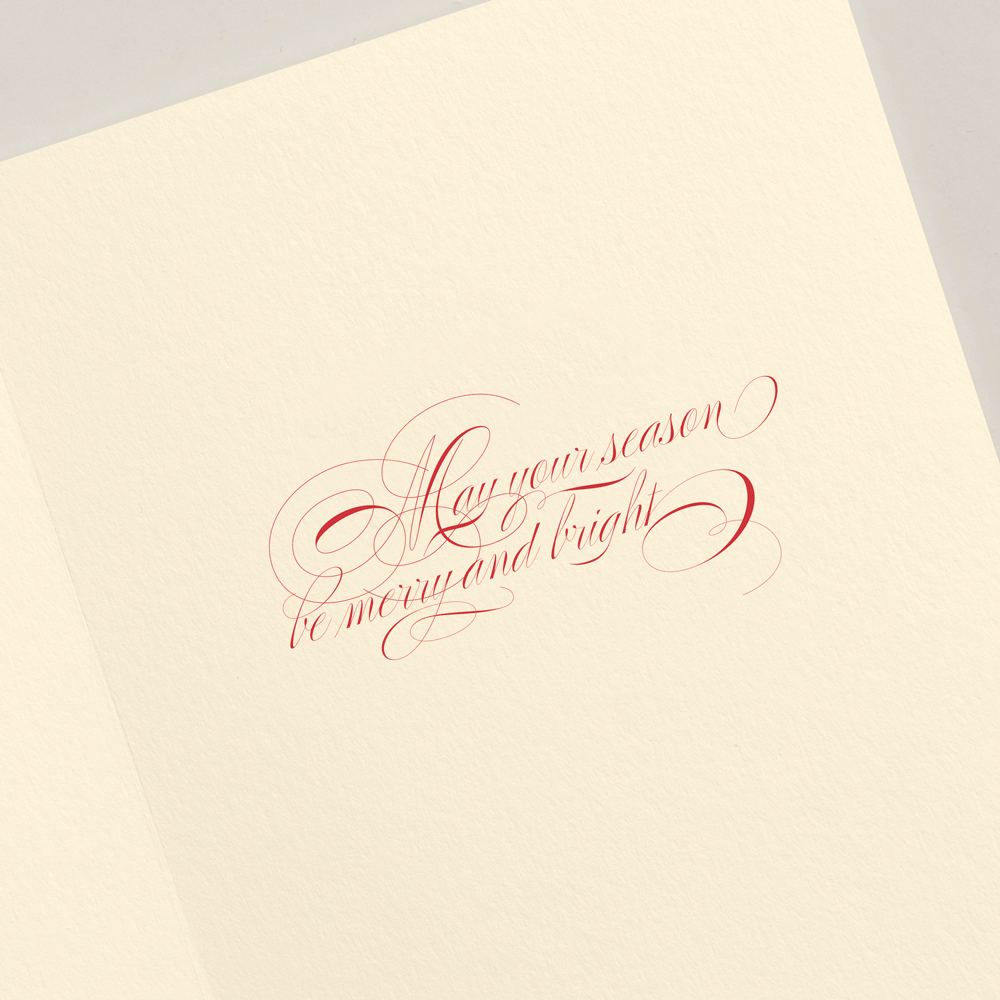 The Crane Christmas Morning Tree Card Set features open greeting cards with red cursive “May your season be merry and bright” on cream paper—perfect for sharing warm wishes this holiday season.