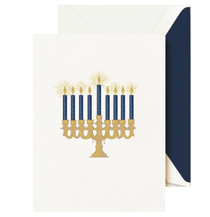 The Crane Lights of Hanukkah Card Set features a gold menorah with nine blue candles, shown with a white envelope lined in dark blue.