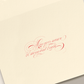 The Crane Sleigh Holiday Card Set features cream-colored cards with red calligraphy reading "May your season be merry and bright" and includes coordinating envelopes—perfect for festive greetings.