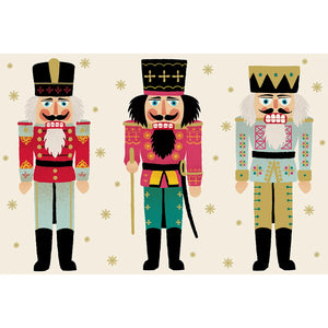 Three nutcracker figures in colorful uniforms on a cream background with gold snowflakes from the Nutcracker Collection.