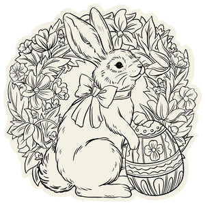 A rabbit with a bow sits by a decorated egg amid a floral wreath—perfect for spring holidays or as charming Hester & Cook Die Cut Coloring Placemats.