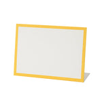 The Hester & Cook Frame Place Cards feature a blank white card with a yellow border, standing upright against a plain background—ideal for use as buffet or charcuterie board labels.