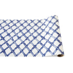 The Paper Runner Collection by Hester & Cook features a blue crisscross lattice pattern on a white background, creating a striking statement piece to elevate any dining space.