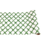 The Hester & Cook Paper Runner Collection features a green lattice pattern on white, making it the perfect statement piece to elevate any dining space.