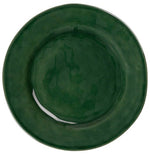 The Juliska Puro Basil Dinnerware Collection features a round ceramic plate in rich green, seen from above, bringing artisanal beauty to any stylish table setting.
