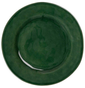 The Juliska Puro Basil Dinnerware Collection features a round ceramic plate in rich green, seen from above, bringing artisanal beauty to any stylish table setting.