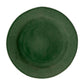 The Juliska Puro Basil Dinnerware Collection features a round, verdant green ceramic plate photographed from above on a white background, highlighting its artisanal beauty.