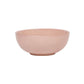 The Puro Blush Dinnerware Collection by Juliska features a simple, round, light pink ceramic bowl with a smooth finish that adds a subtle blush tone to any stylish table setting.