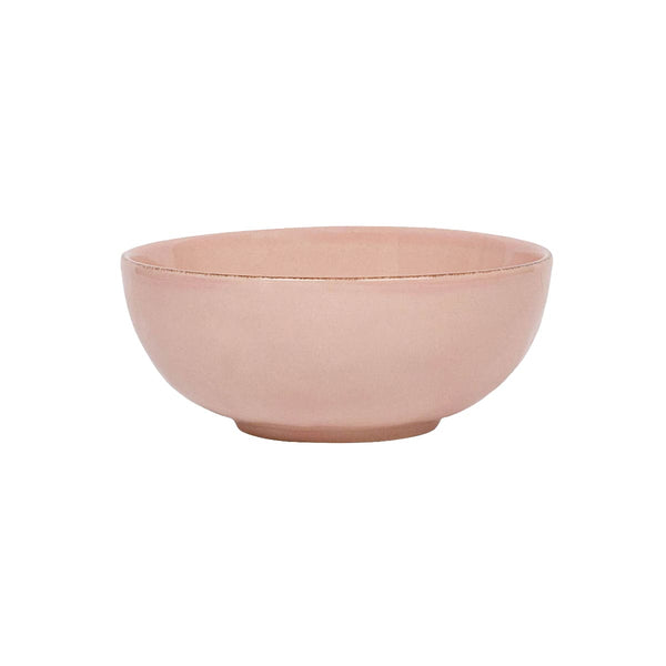 The Puro Blush Dinnerware Collection by Juliska features a simple, round, light pink ceramic bowl with a smooth finish that adds a subtle blush tone to any stylish table setting.