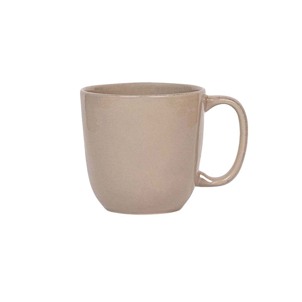 The Juliska Puro Taupe Dinnerware Collection features a plain beige ceramic mug with a handle, shown against a white background—ideal for elegant table settings and timeless style.