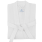 The Kiran Robe by Matouk is a folded, white, luxurious robe made from Turkish waffle fabric, featuring a front-tied belt and a visible "Matouk" label on the collar.