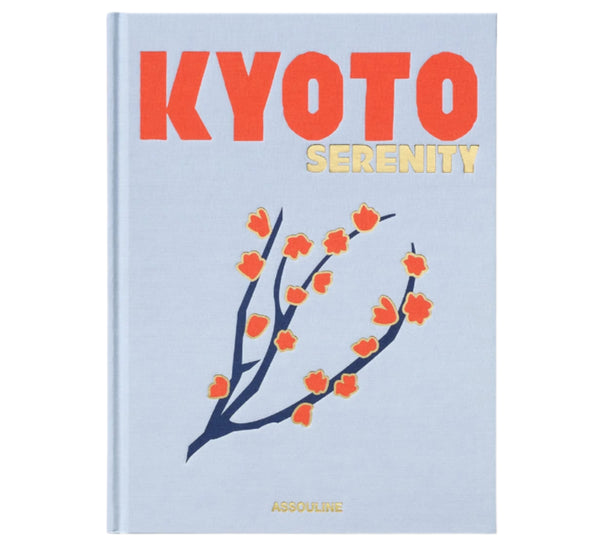 The "Kyoto Serenity" book by Assouline features a cover with stylized red and orange flowers on a light blue background, celebrating Japanese culture and evoking the vibrant Gion Matsuri festival.