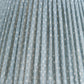 Close-up of the Fermoie Blue Figured Lampshade by John Rosselli, showcasing light blue pleated fabric with a subtle white dotted pattern and visible woven texture.