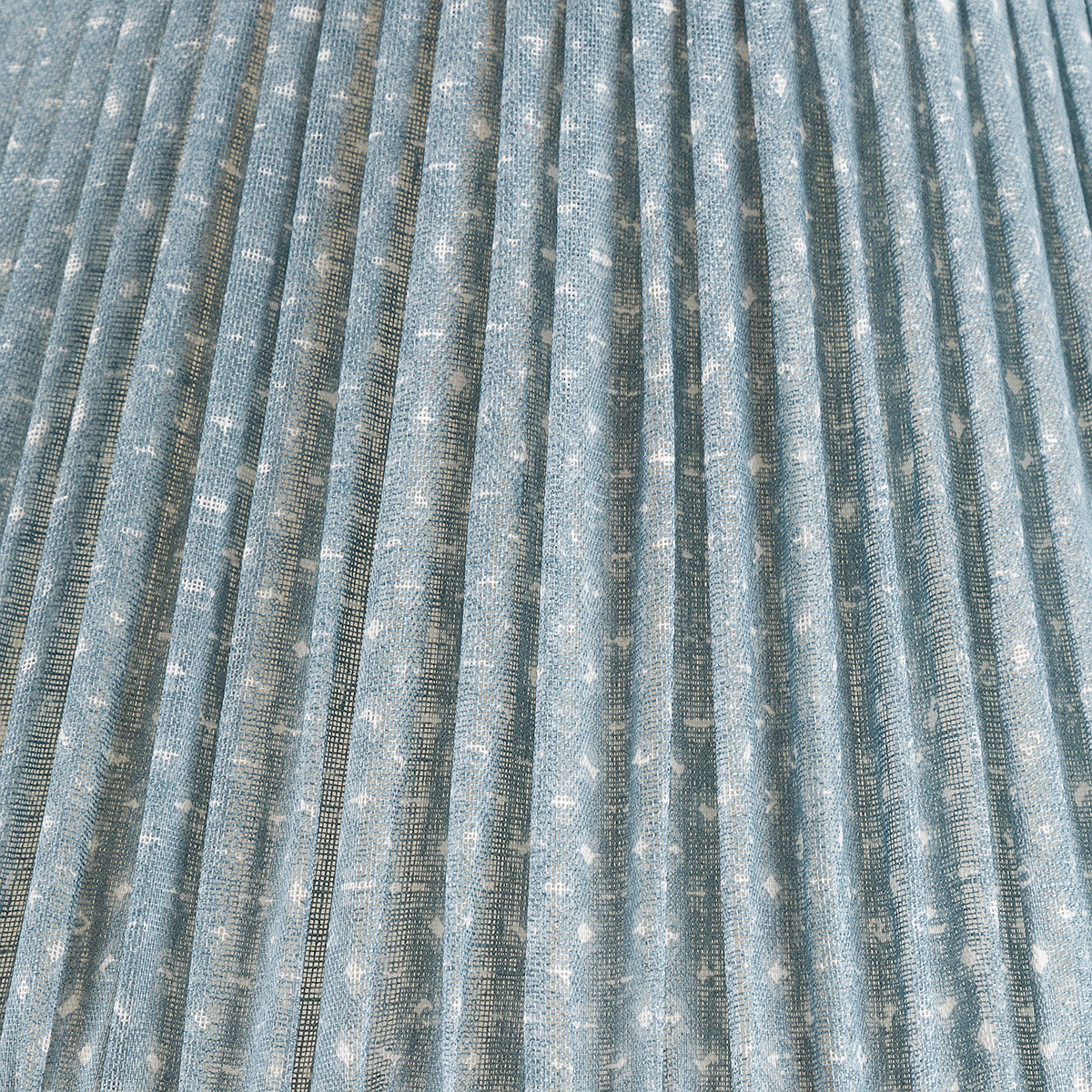 Close-up of the Fermoie Blue Figured Lampshade by John Rosselli, showcasing light blue pleated fabric with a subtle white dotted pattern and visible woven texture.