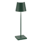 The Poldina Pro Lamp Collection by Zafferano America features a modern, dark green cordless LED table lamp with a conical shade and square base—ideal for indoor or outdoor use—displayed on a plain white background.