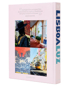 Assouline’s "Lisboa Luz" book, with a pale pink cover, features four photos of Lisbon scenes and a quote on the front, capturing the city’s unique charm.