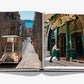 Lisboa Luz by Assouline opens to photos of a vintage tram on Lisbon’s cobblestone streets and a woman entering a historic shop, capturing the city’s charm and authentic Portuguese culture.