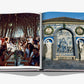 An open book, Lisboa Luz by Assouline, shows people dining outdoors under trees on one page and a blue-tiled fountain with statues on the other—capturing Portuguese culture and the vibrant spirit of Lisbon.