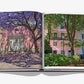 The open book "Lisboa Luz" by Assouline features photos of pink buildings amid trees and purple blossoms, offering a glimpse of Portuguese culture and the vibrant beauty that awaits on your next adventure in Lisbon.